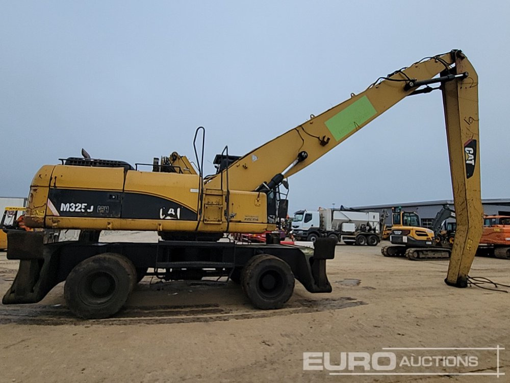 Pelle sur pneus 2013 CAT M325D: photos 6