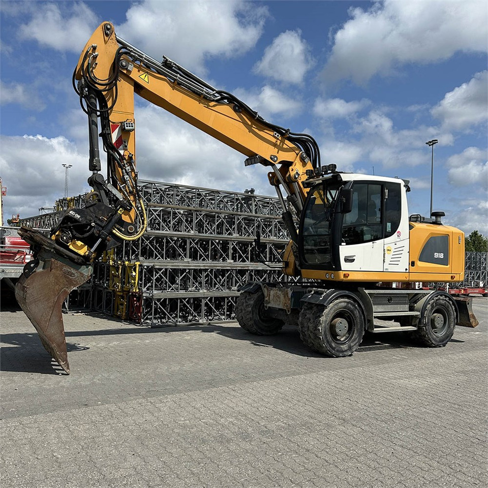 Liebherr A 918 Litronic - Pelle sur pneus: photos 1 Liebherr A 918 Litronic - Pelle sur pneus: photos 1