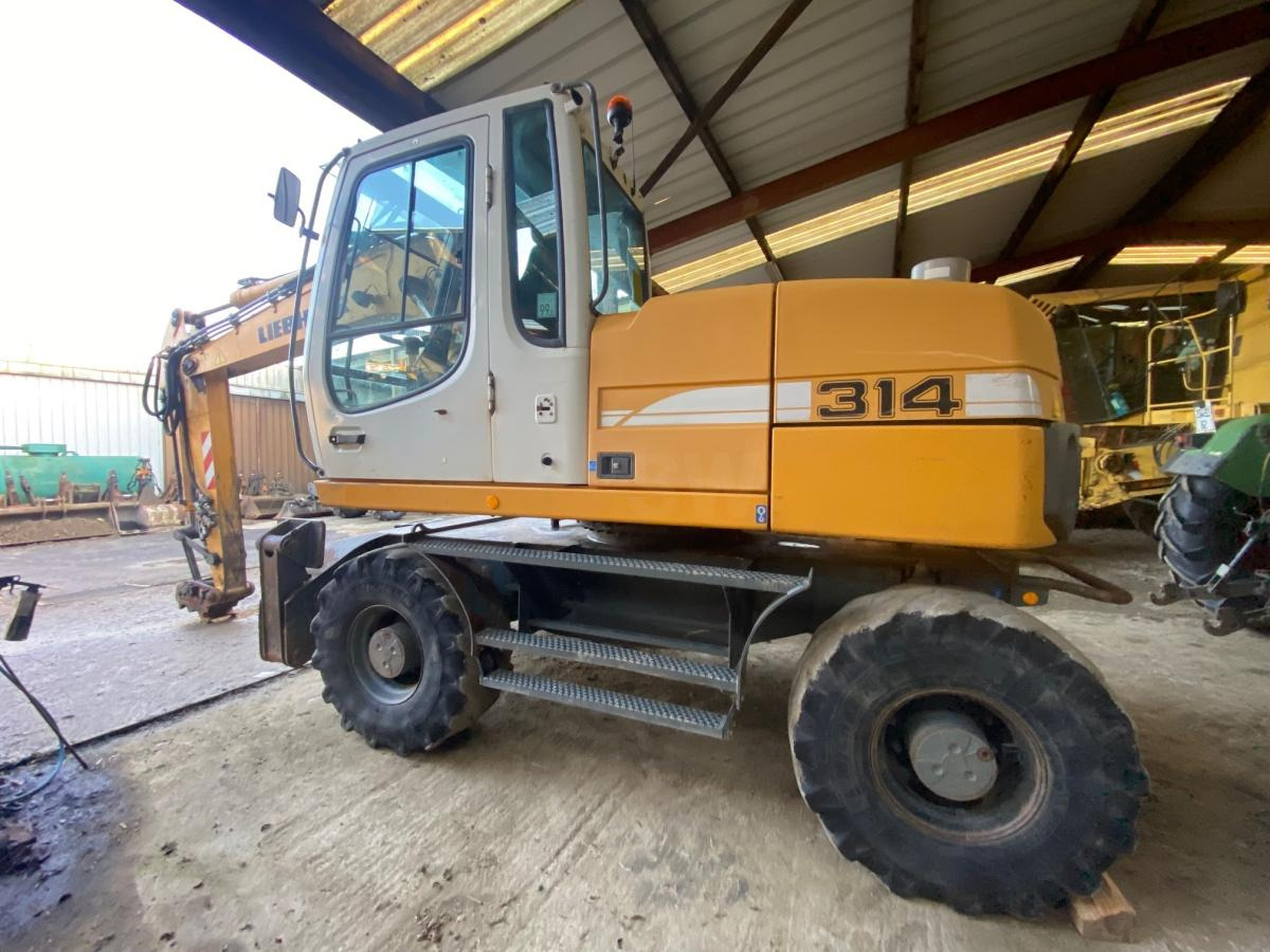 Liebherr A314 Litronic - Pelle sur pneus: photos 4 Liebherr A314 Litronic - Pelle sur pneus: photos 4