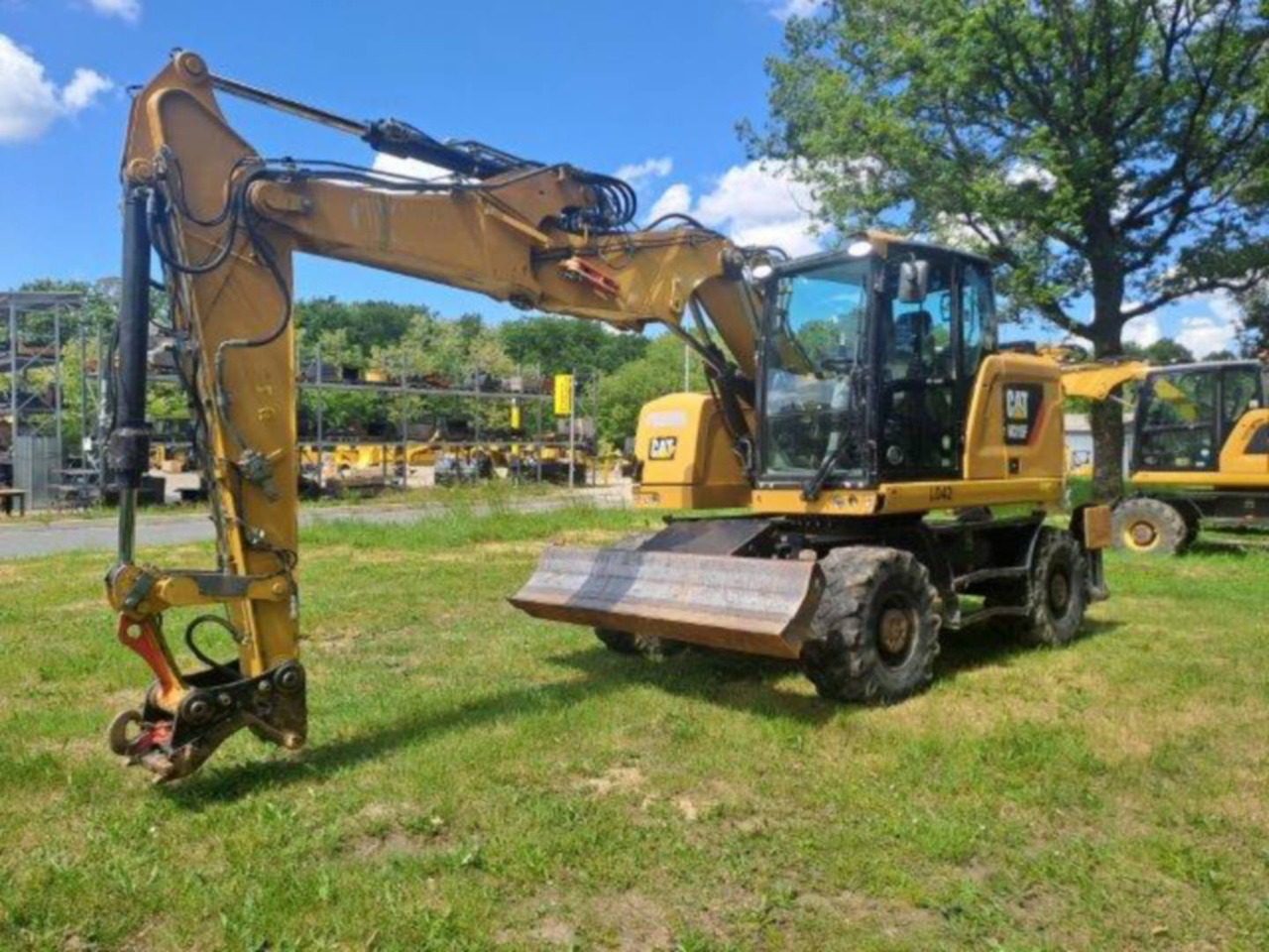 CAT M315F IVC - Pelle sur pneus: photos 1 CAT M315F IVC - Pelle sur pneus: photos 1