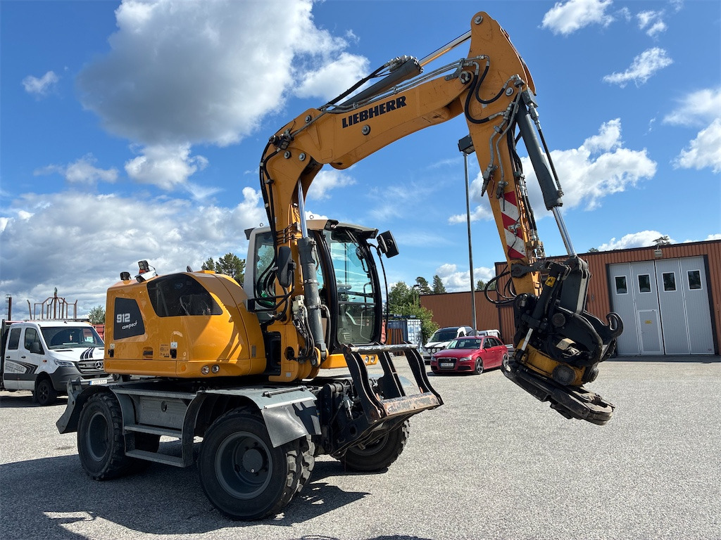 Liebherr 912 Compact - Pelle sur pneus: photos 3 Liebherr 912 Compact - Pelle sur pneus: photos 3